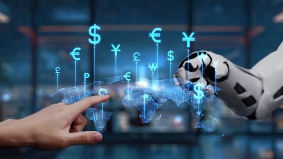 Human hand and robotic hand reach toward floating currency symbols over a holographic world map, symbolizing fintech collaboration with AI-driven finance.