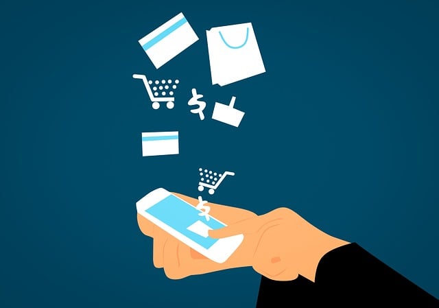 Person holds a smartphone with shopping icons (credit card, cart, bag) floating above, depicting online shopping.