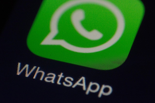 Green WhatsApp app icon with a white speech bubble and phone symbol on a dark background.