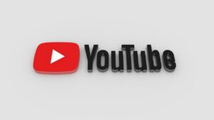 YouTube brand logo with a red rounded square and white play button beside bold black 'YouTube' text on a light gray background.
